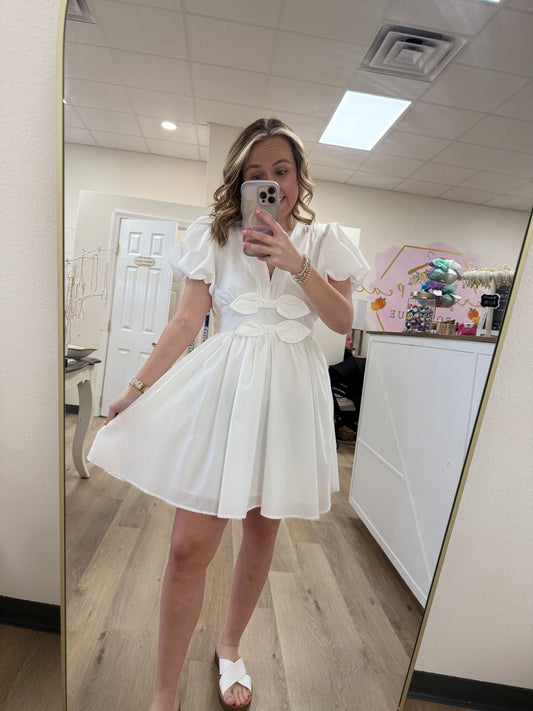 Entro Solid v-neck short puff bubble sleeve fit-and-flare pullover mini dress featuring oversized bows